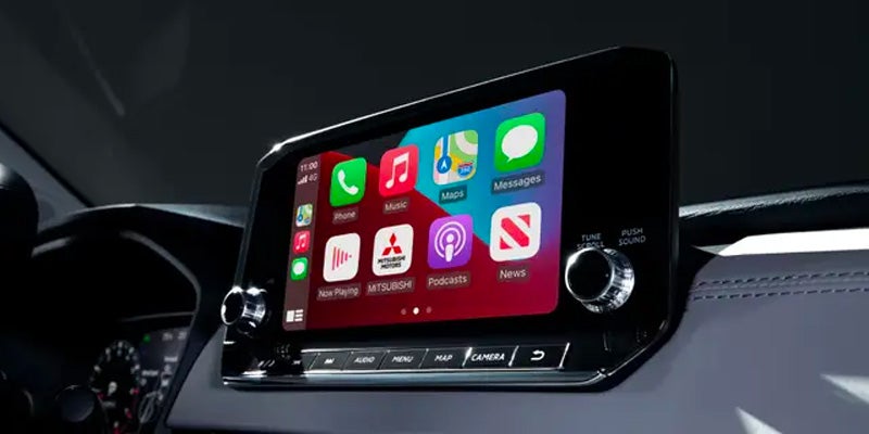Vehicle infotainment screen with Apple CarPlay display.